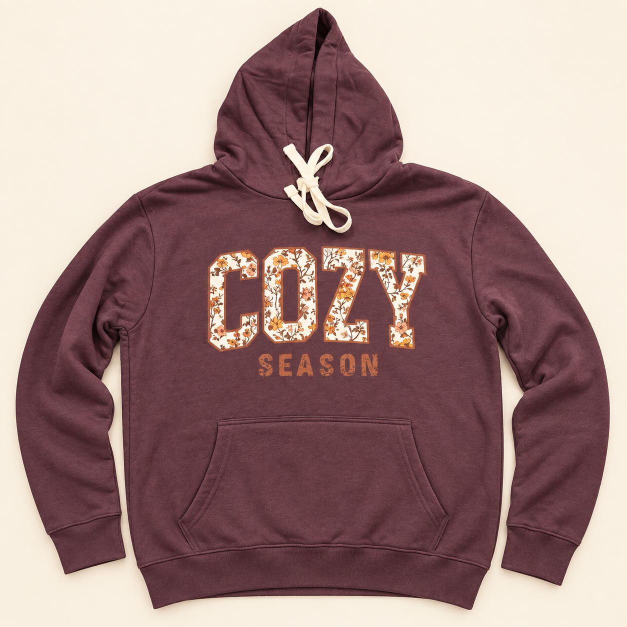 Plum pullover hoodie with a floral Cozy Season front print